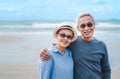 Happy asian couple senior eldery retirement resting at beach honeymoon Royalty Free Stock Photo