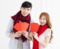 Couple showing red envelope for chinese new year