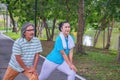 They are happy Asian couple.They  are warm up for exercise in park. Royalty Free Stock Photo