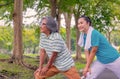 They are happy Asian couple.They  are warm up for exercise in park. Royalty Free Stock Photo