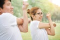 Happy Asian couple in white shirt workout at the park. Royalty Free Stock Photo