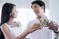 They bought a new home to fulfill their married life, Focusing on a simulated wooden house. Royalty Free Stock Photo