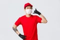 Happy asian delivery guy in medical mask tell give call, wink cheeky to client, keep in touch when delivery needed, fast