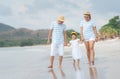 Happy asian family on the beach.