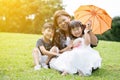 Happy Asian Family Enjoying Day In Park Royalty Free Stock Photo