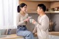 Happy asian family enjoying morning coffee at home Royalty Free Stock Photo