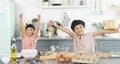 Happy asian family funny kids are preparing the dough, bake cookies in the kitchen Royalty Free Stock Photo