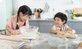 Happy asian family funny kids are preparing the dough, bake cookies in the kitchen Royalty Free Stock Photo