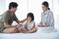 Happy Asian family having breakfast with milk bread sausages at bedroom