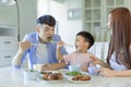 Happy Asian  family having dinner at home Royalty Free Stock Photo