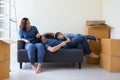 Happy Asian family having fun during moving day and relocating at new home. Royalty Free Stock Photo