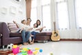 Happy asian family in living room at home