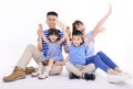 Happy asian family looking at camera and  sitting on white background Royalty Free Stock Photo