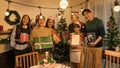Happy Asian family with with multi generations celebrating christmas with gifts in living room with Christmas tree Royalty Free Stock Photo