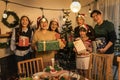 Happy Asian family with with multi generations celebrating christmas with gifts in living room with Christmas tree Royalty Free Stock Photo