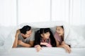 Happy asian family people leisure in bedroom together