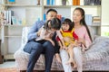 Happy Asian family playing together at sofa, home living room Royalty Free Stock Photo