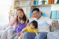 Happy Asian family playing together at sofa in home living room, the image of a happy Asian family Royalty Free Stock Photo