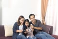 Happy asian family playing a video game Royalty Free Stock Photo