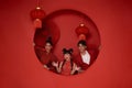 Happy asian family in red casual attire with gesture of congratulation greeting happy chinese new year 2024 Royalty Free Stock Photo