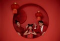 Happy asian family in red casual attire with gesture of congratulation greeting happy chinese new year 2024 Royalty Free Stock Photo