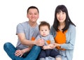 Happy Asian family sitting on floor Royalty Free Stock Photo