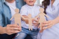 Happy asian family sitting on the sofa in the living room of their home together Royalty Free Stock Photo