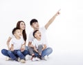 Happy Asian family  sitting on white floor and looking up Royalty Free Stock Photo