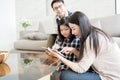 Happy asian family spending time together in living room. family and home concept. Royalty Free Stock Photo