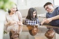 Happy asian family spending time together in living room. family and home concept. Royalty Free Stock Photo