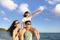 Happy family standing on the beach watch the sunset Royalty Free Stock Photo