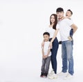 Happy Asian family standing together on white background Royalty Free Stock Photo