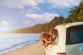 Happy Asian family with trip car travel having fun and enjoying on beach in summer vacation holiday Royalty Free Stock Photo