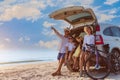 Happy Asian family with trip car travel having fun and enjoying on beach in summer vacation holiday Royalty Free Stock Photo