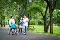 Happy asian family walking,care,talk,child girl or granddaughter and senior grandmother,father,mother having fun,laugh,smile, Royalty Free Stock Photo