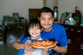 Happy asian father and daughter preparing homemade pizza Royalty Free Stock Photo