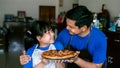 Happy asian father and daughter preparing homemade pizza Royalty Free Stock Photo