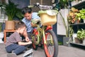 Happy Asian Father and son spend time together, Dad and son playing and repairing bicycle wheel at home Royalty Free Stock Photo