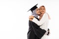 Happy asian female graduate student wearing toga hugging her mother