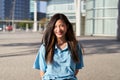 Happy asian female Student. Girl smiling at camera outdoors on campus of university