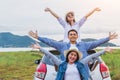 Happy Asian friends spread arms widely and breathed fresh air with happiness mood in on raod trip in car trunk. People lifestyle