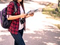 Happy Asian girl backpack in the road and forest background Royalty Free Stock Photo