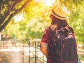 Happy Asian girl backpack in the road and forest background Royalty Free Stock Photo