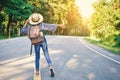 Happy Asian girl backpack in the road Royalty Free Stock Photo