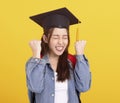 Happy Asian girl college student in Graduation cap  with success gesture Royalty Free Stock Photo