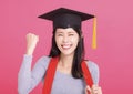 Happy Asian girl college student in Graduation cap  with success gesture Royalty Free Stock Photo