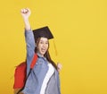 Happy Asian girl college student in Graduation cap  with success gesture Royalty Free Stock Photo