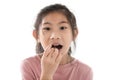 Happy Asian girl eating chocolate cornflakes