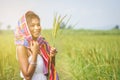 Happy Asian girl enjoy in green rice field, countryside of Thailand at sunset Royalty Free Stock Photo