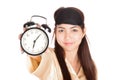 Happy Asian girl with eye mask show alarm clock Royalty Free Stock Photo